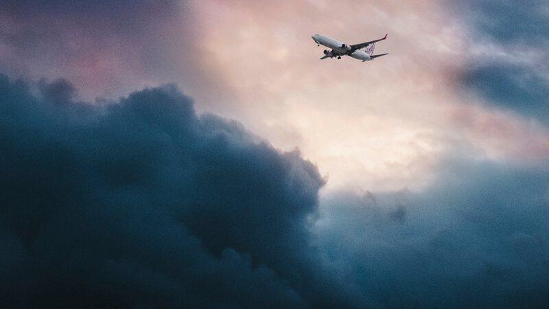 An airplane flying through a storm.
