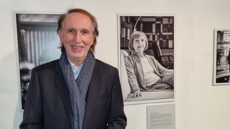*Dr. Jorge Grünberg, rector  Universidad ORT Uruguay, next to a portrait of Prof. Charlotte de Grünberg, general director of ORT Uruguay