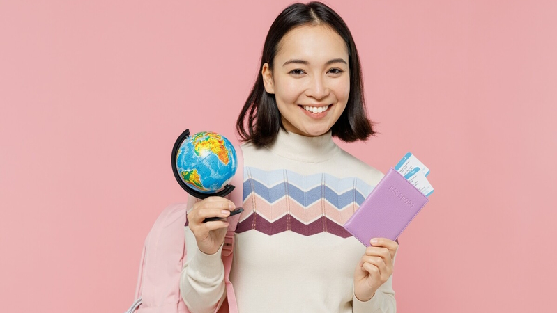 Student with a world map