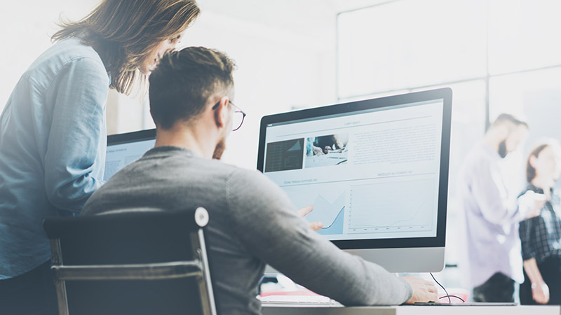 A group of people working together at a computer