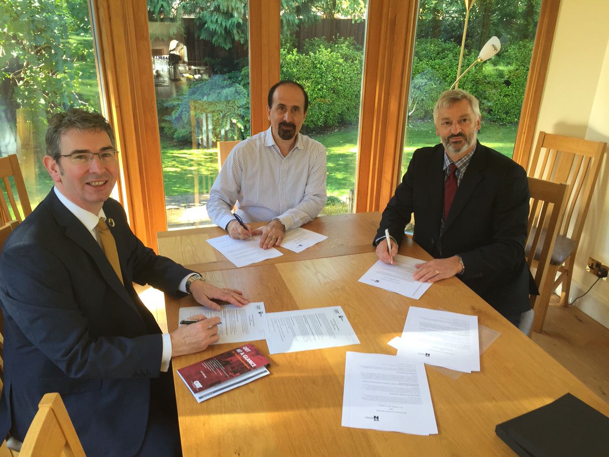 Signing of the ORT-Northampton agreement by Dean Sinclair, Dean Hipogrosso, and Rector . Nick Petford.